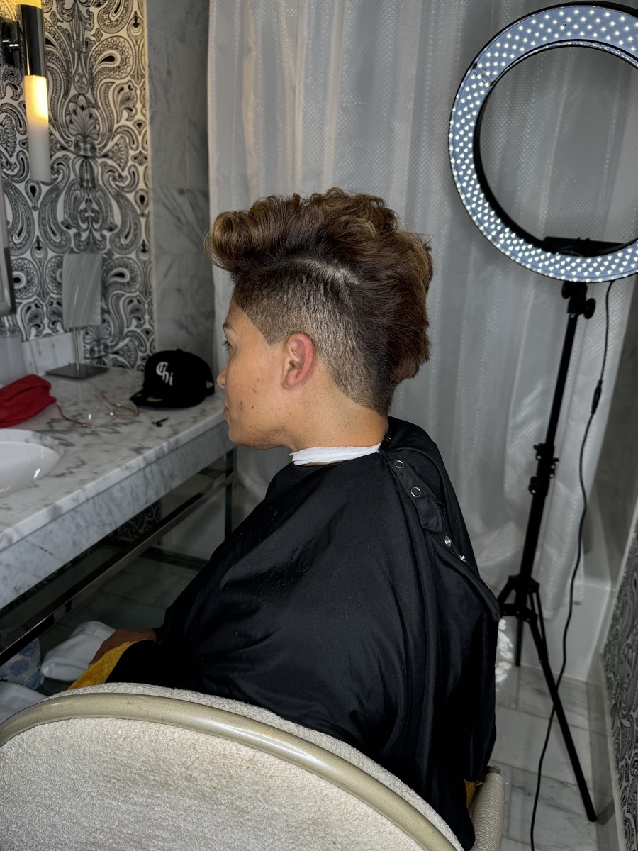 Textured top with a clean tapered fade, side profile